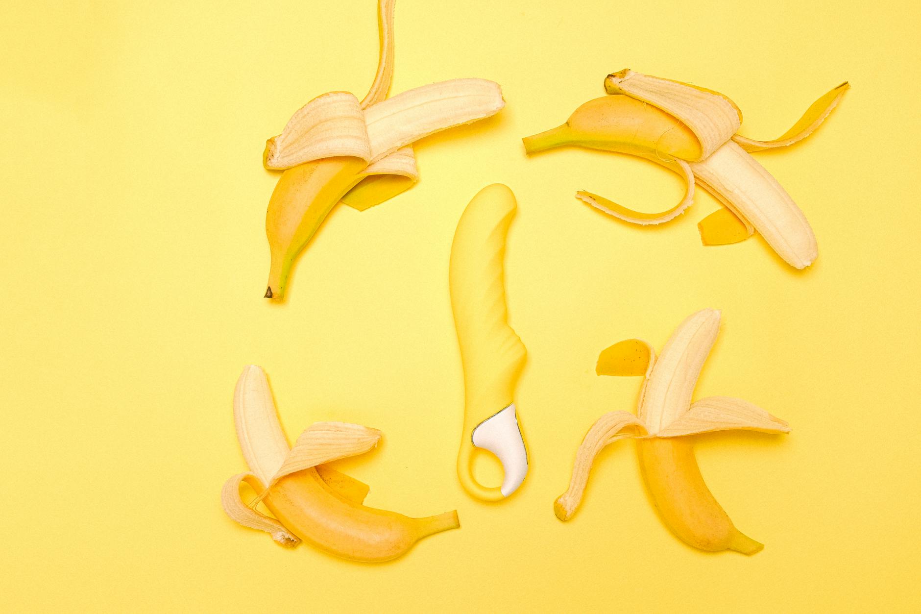 Yellow lemon clitoral vibrator on a bright yellow background symbolizing fresh start to pleasure