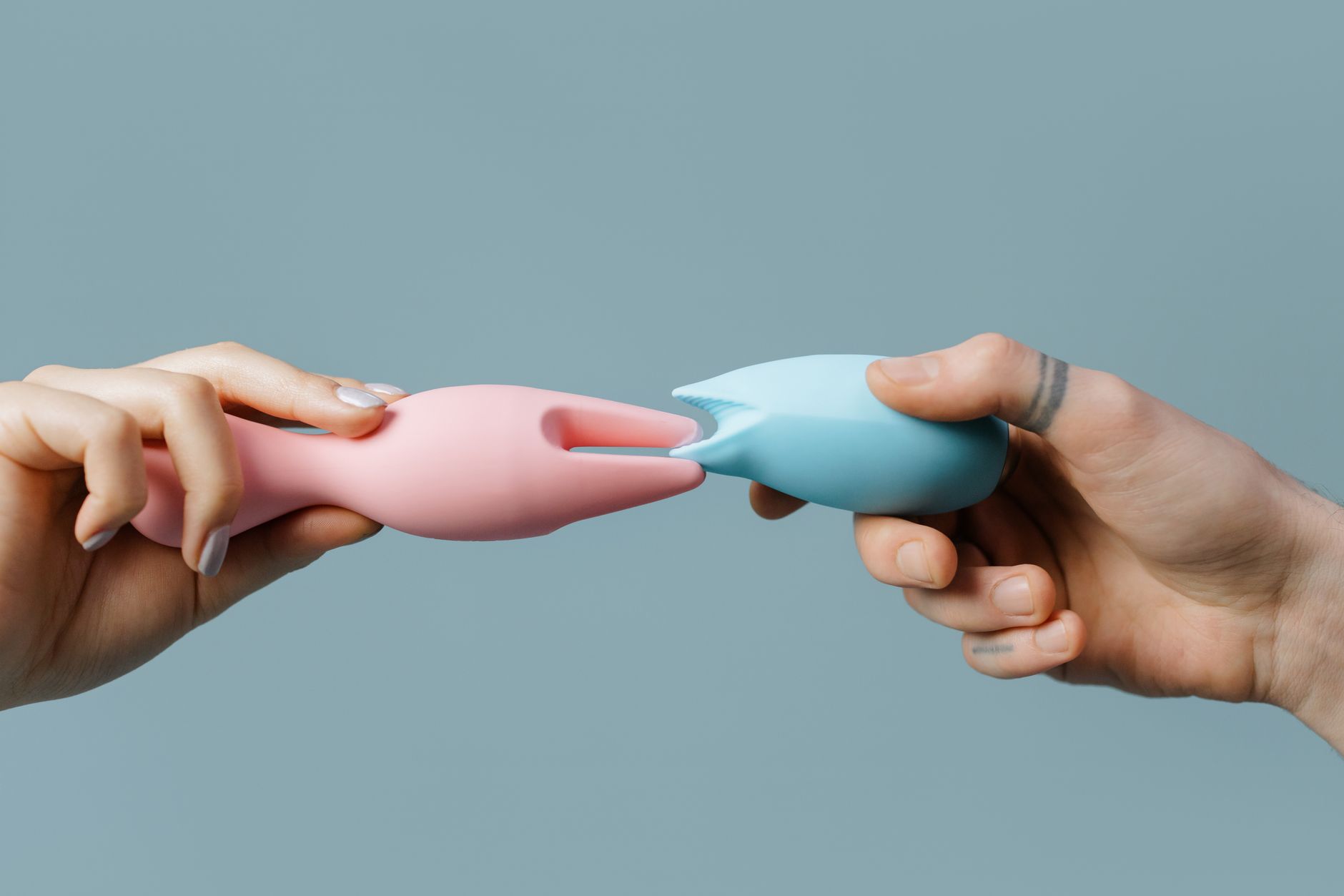 Close-up of hands holding colorful silicone toys